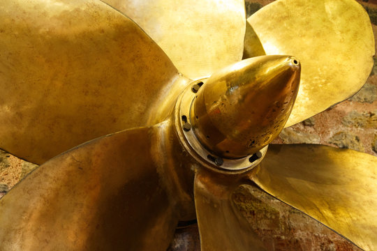 Bronze six bladed propeller screw of a boat or ship. The brass ship screw propeller helps in ship navigation