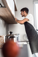 close up. a man washes an Apple under the tap