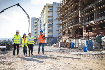 Fotobehang Group of construction workers on building site.Stock photo © romul014
