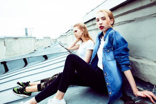 two cool blond real girls friends making selfie on roof top, lifestyle people concept, modern teens