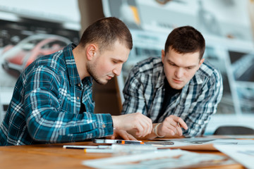 Two engineers thinking about a new design.
