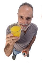 man with a glass of orange soda on white background