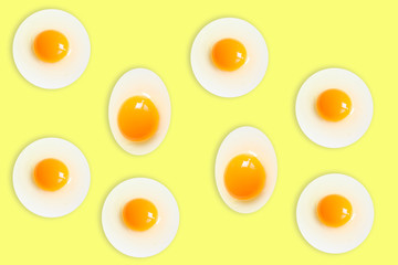 Eggs Organic Oval  oblong round  (White eggs and  yolk )of chicken Cooked high protein good for health decorative food pattern isolated on  Pastel light yellow  background texture close-up