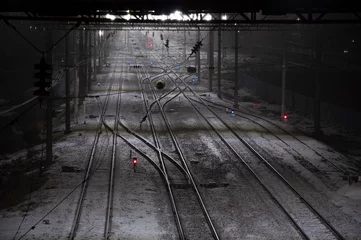 Fototapeten Verlassene Gebäude Top view of snow covered railway tracks.  © Murphy Alone