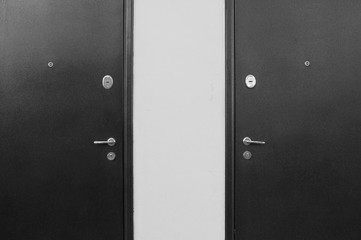 Two black and white symmetrical doors.