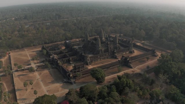 Angkor Wat Temple in Cambodia sunrise fog drone flight