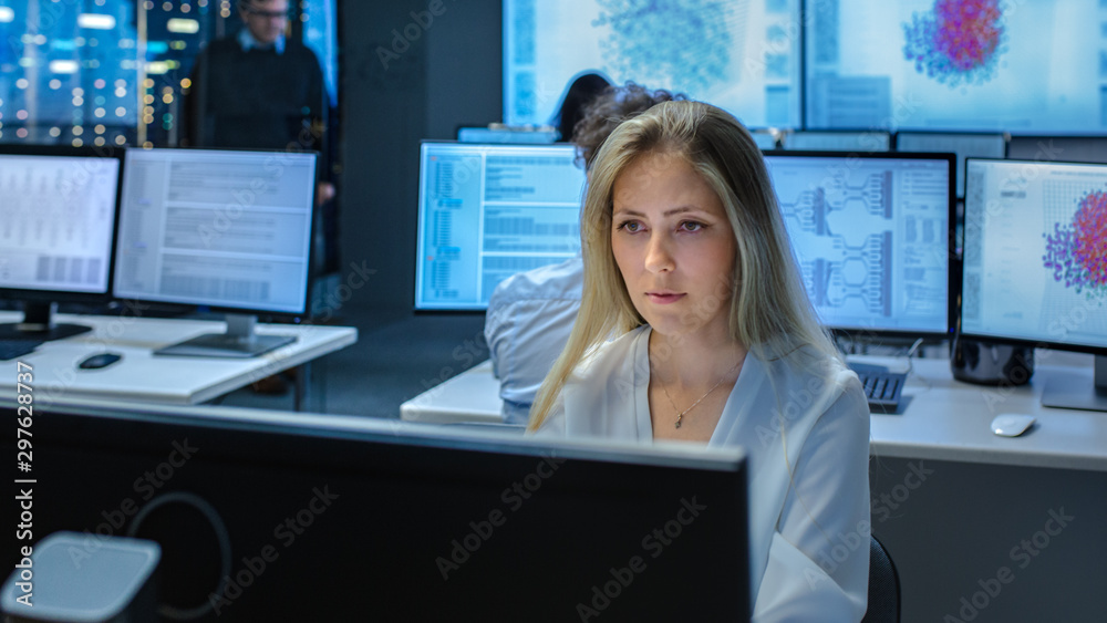 Poster Female Computer Engineer Works on a Neural Network/ Artificial Intelligence Project with Her Multi-Ethnic Team of Specialist. Office Has Multiple Screens Showing 3D Visualiation.