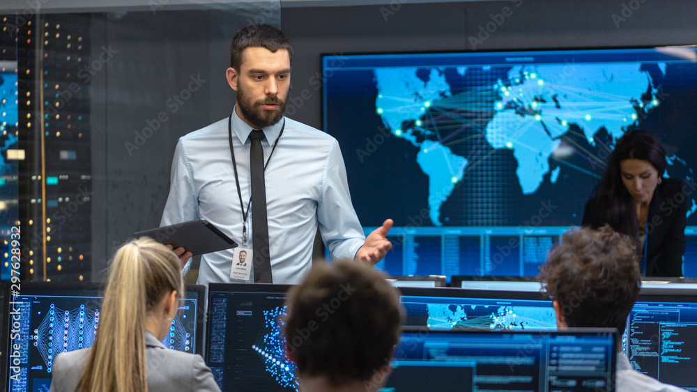 Poster Chief Project Engineer Holds Briefing for a Team of Scientists that are Building Machine Learning System. Displays Show Working Model of Neural Network. 