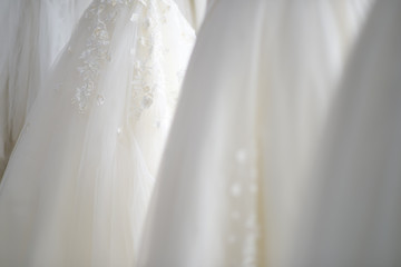 Stacked hanging white wedding dress