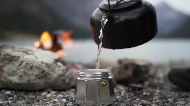 Pouring hot Water into a old Espresso maker