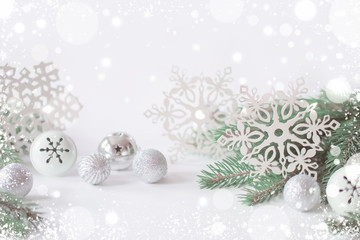 Fototapeta na wymiar Christmas white background with snowflakes, decorations, sparks close-up.