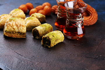 Baklava on table. Middle eastern or arabic dishes. Turkish Dessert Baklava with pistachio on rustic table