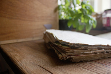 grandma's old receipes on a stapel in wooden kitchen