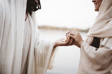 Scene - of Jesus Christ handing out bread with a blurred background