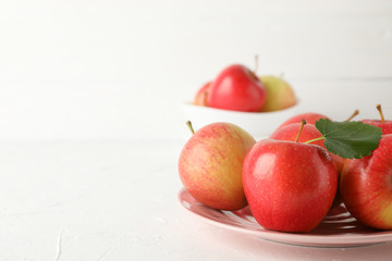 Plate with apples on white background, close up