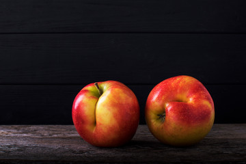 Concept of ugly food - red apple on background