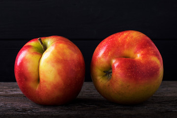 Concept of ugly food - red apple on background