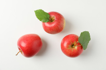 Flat lay with red apples on white background, space for text