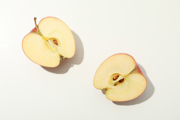 Halves of apple on white background, space for text