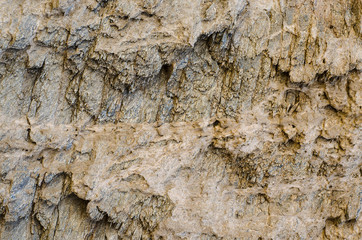 The texture of the layered rock is light brown, sandy rock. Ideas for design.