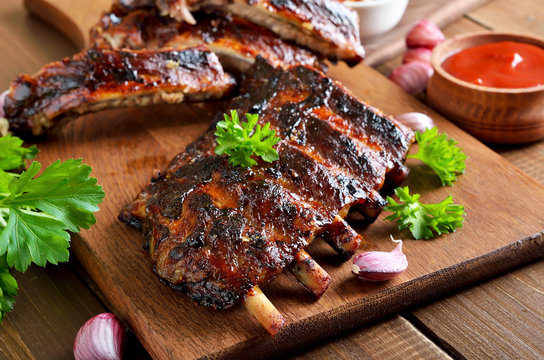 Spicy hot grilled spare ribs on cutting board