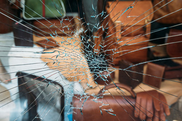 Shattered window of a store - 297636505