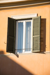 Window and shutters of ancient Rome, old buildings facade