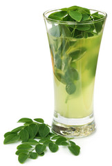 Moringa leaves with extract in a glass