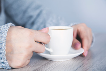 woman hand cup of coffee