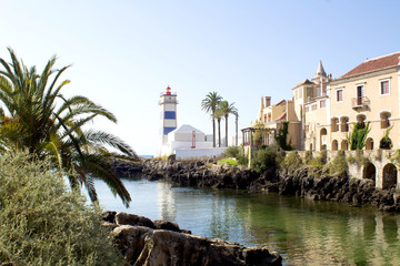 Beautiful view of the beach, lighthouse  and villa on the sunny day. Cascais. Portugal.