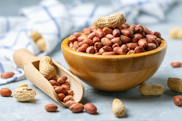 Organic peanuts in a wooden bowl.