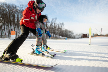 Young girl takes a skiing lesson