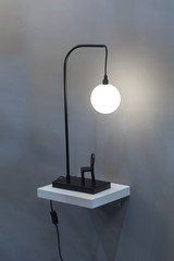 Modern table lamp, black night lamp in the form of a ball hanging over a chair. Small original...