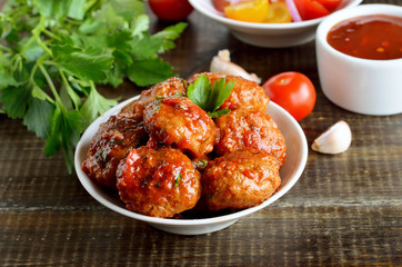 Fried meatballs in white bowl, parsley and tomato sauce - obrazy, fototapety, plakaty