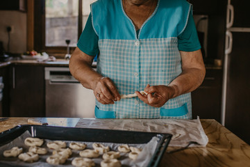 lady or grandmother preparing christmas candy or cakes