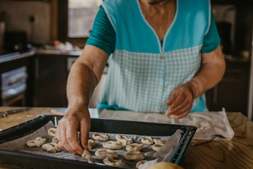 lady or grandmother preparing christmas candy or cakes
