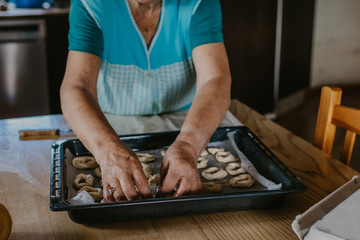 lady or grandmother preparing christmas candy or cakes