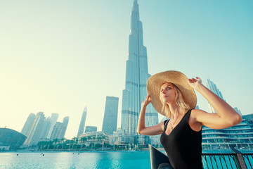 Young travelling woman enjoying the view of Dubai downtown.