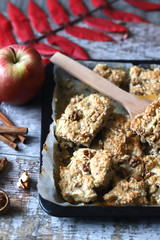 Homemade fitness cookies on a baking sheet. Healthy diet cookies. Homemade oatmeal cookies with cinnamon and apple.