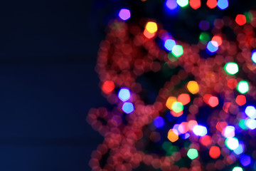 Abstract blurred colorful background with flickering light bulbs. Holiday concept. New Year's and...