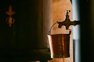 Detalis of medieval traditional distiller cube made from copper production of alcohol, cognac,...