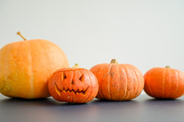 Jack o lanterns Halloween pumpkin face. A lot of orange pumpkins on a white background.