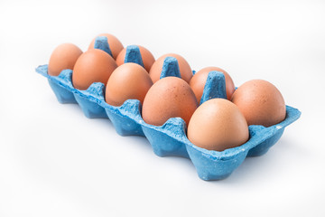 cardboard box with brown chicken eggs