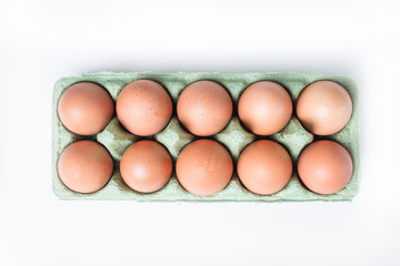 cardboard box with brown chicken eggs