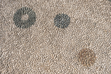 texture of the road paved with gray pebbles