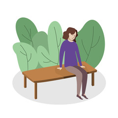 A young teenager girl sits in a park on a bench and cries, she is very upset, she has depression, a psychological problem.