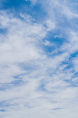 White fluffy clouds in the blue sky in summer