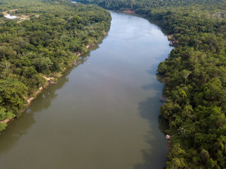 Obraz premium Beautiful aerial drone view of Rio Teles Pires and Amazon rainforest on sunny summer day near Sinop city, Mato Grosso, Brazil. Concept of climate change, conservation and natural resources.