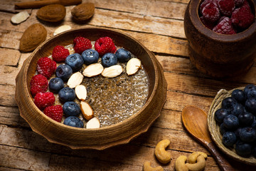 Obraz na płótnie Canvas Chia seed healthy porridge with berry fruits