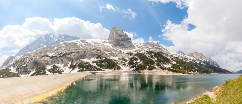 Lake Fedaia and dam at the foot of Marmolada mountain